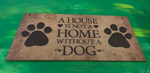Skylt - A house is not a house without a dog